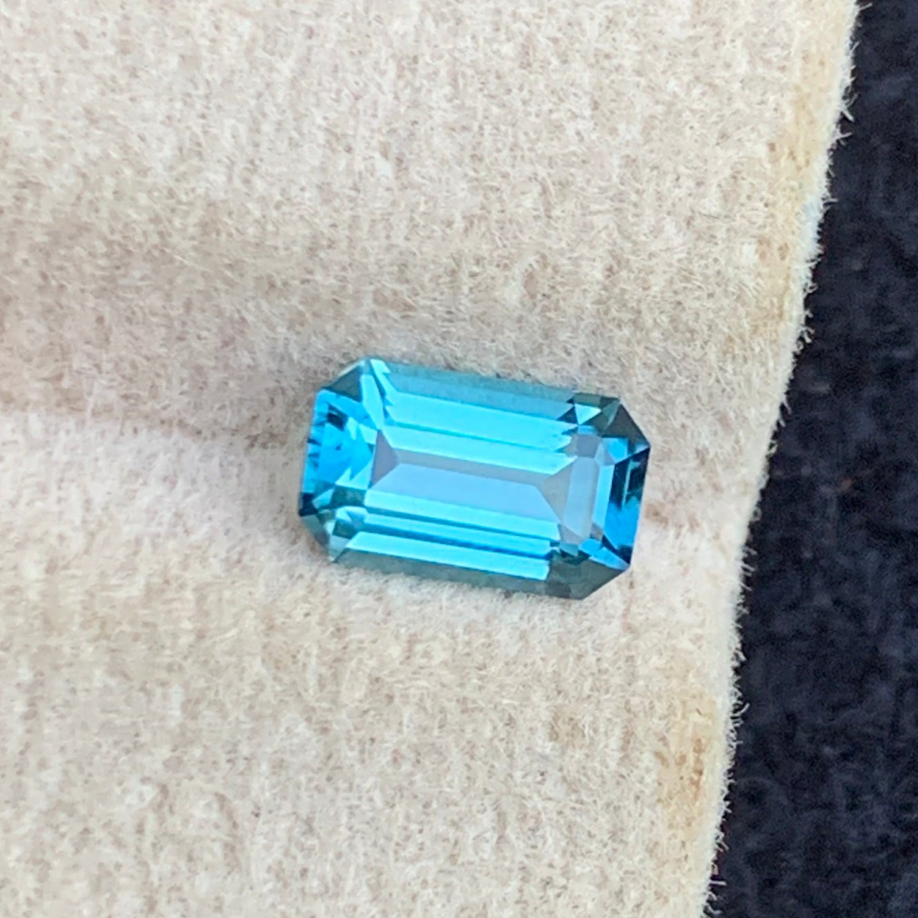 Neon Blue Tourmaline 
Neon Blue Tourmaline jewelry
0.60 carat neon blue tourmaline emerald cut natural gemstone
Afghanistan neon blue tourmaline loupe clean gemstone close view