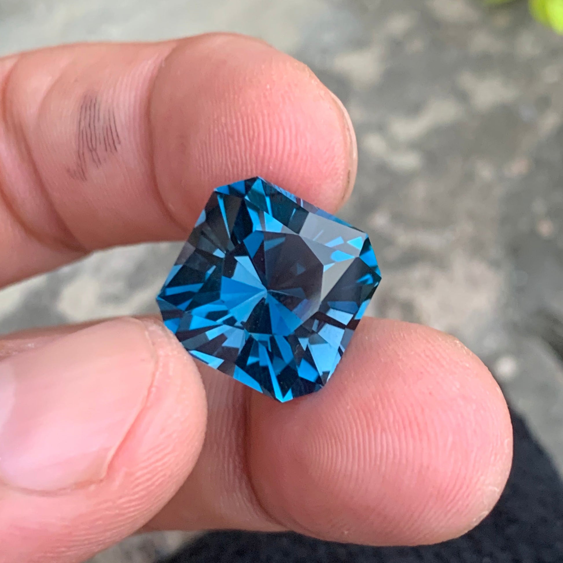  Blue Topaz ring
 Blue Topaz pendant
19.25 carat London blue topaz Asscher cut gemstone
large blue topaz gemstone Africa loupe clean stone