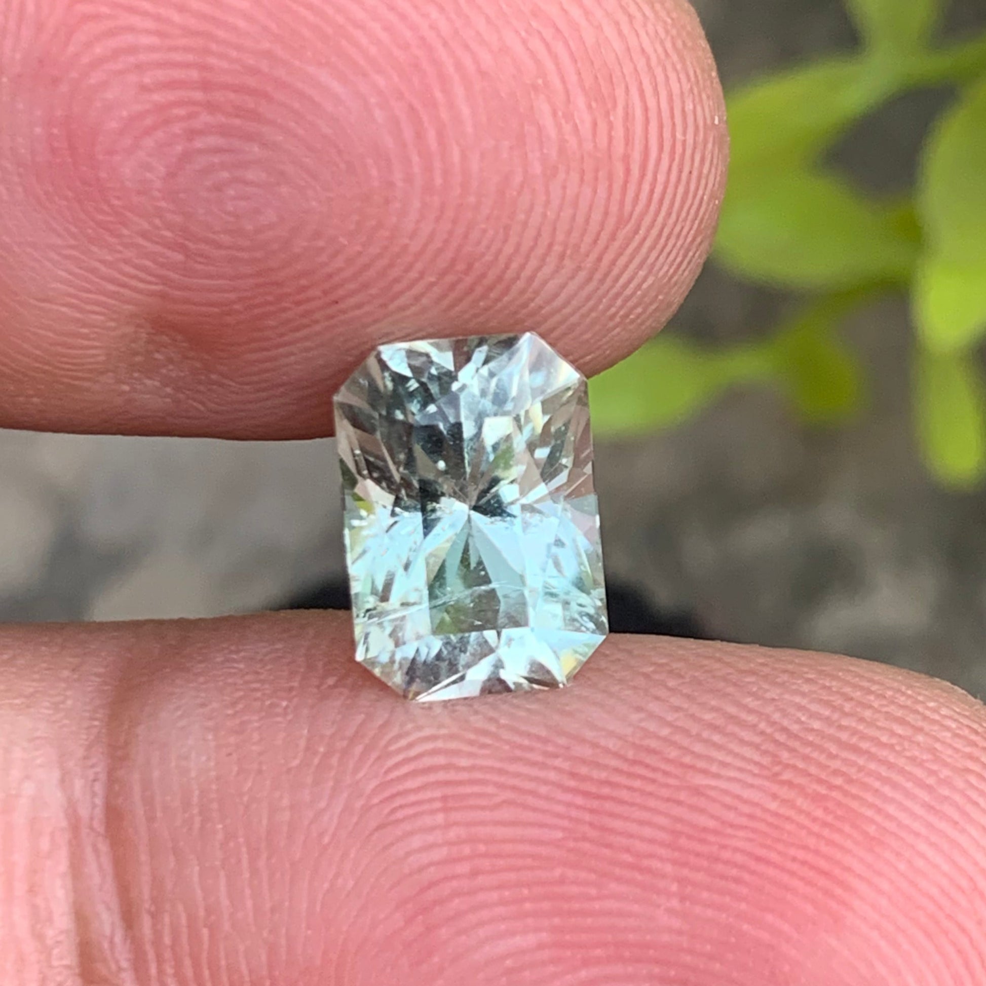 2.95 carat achroite tourmaline loose stone

natural colorless tourmaline gemstone

radiant cut achroite tourmaline close up