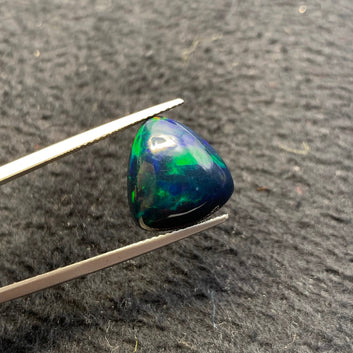 5 carat Ethiopian opal AAA quality

blue green opal stone with rainbow fire

triangular opal gemstone loose stone
