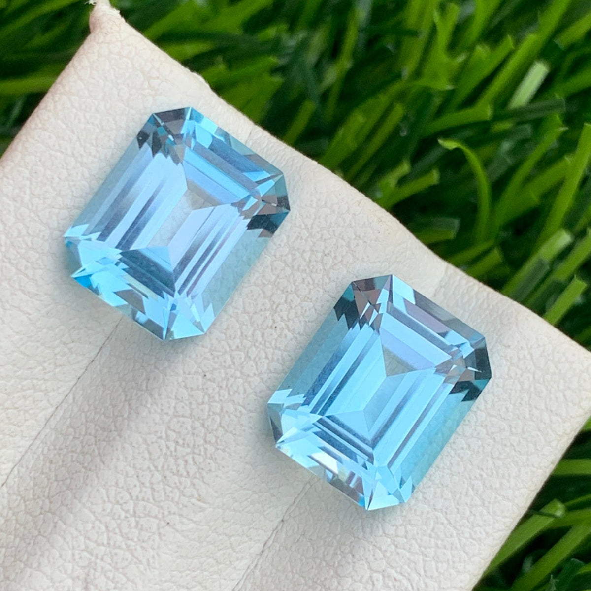 Swiss blue topaz earrings
Swiss blue topaz gift
9.00 ct Swiss blue topaz pair on white background Onestep Gems
Step-cut blue topaz gemstones for drop and dangle earrings