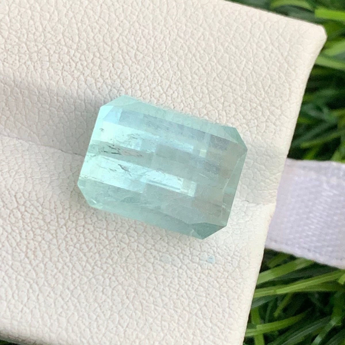 Aquamarine loose stone on white background
Pixel cut gemstone dimensions 12.71 x 9.78 x 8.58mm