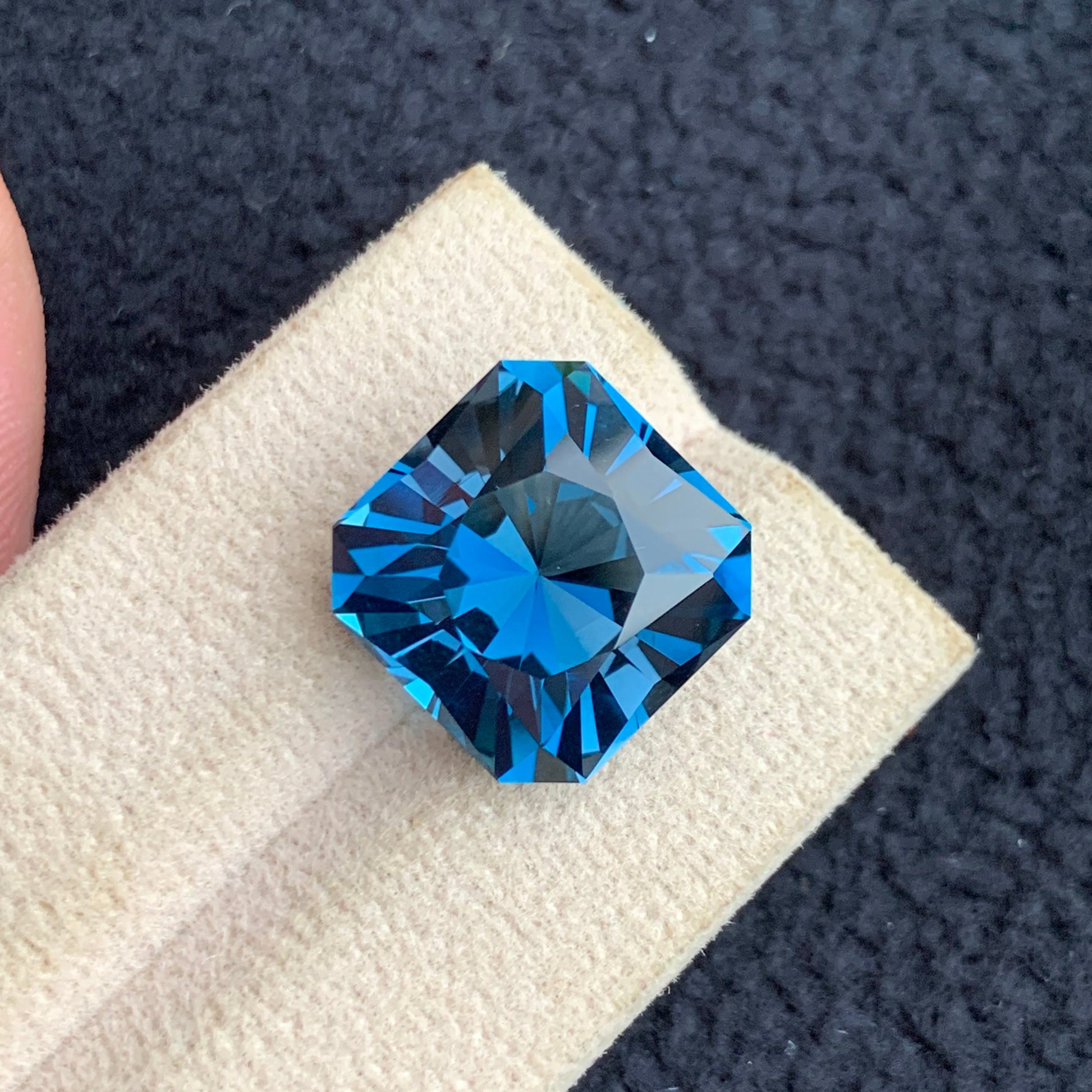  Blue Topaz
 Blue Topaz jewelry
Asscher cut London blue topaz loose gemstone close view
deep blue topaz 19 carat statement jewelry stone