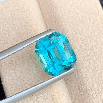 Neon Blue Tourmaline Gemstone
Neon Blue Tourmaline Jewelry
Blue cushion cut tourmaline gemstone close-up
Rare neon blue tourmaline 5 carats gemstone