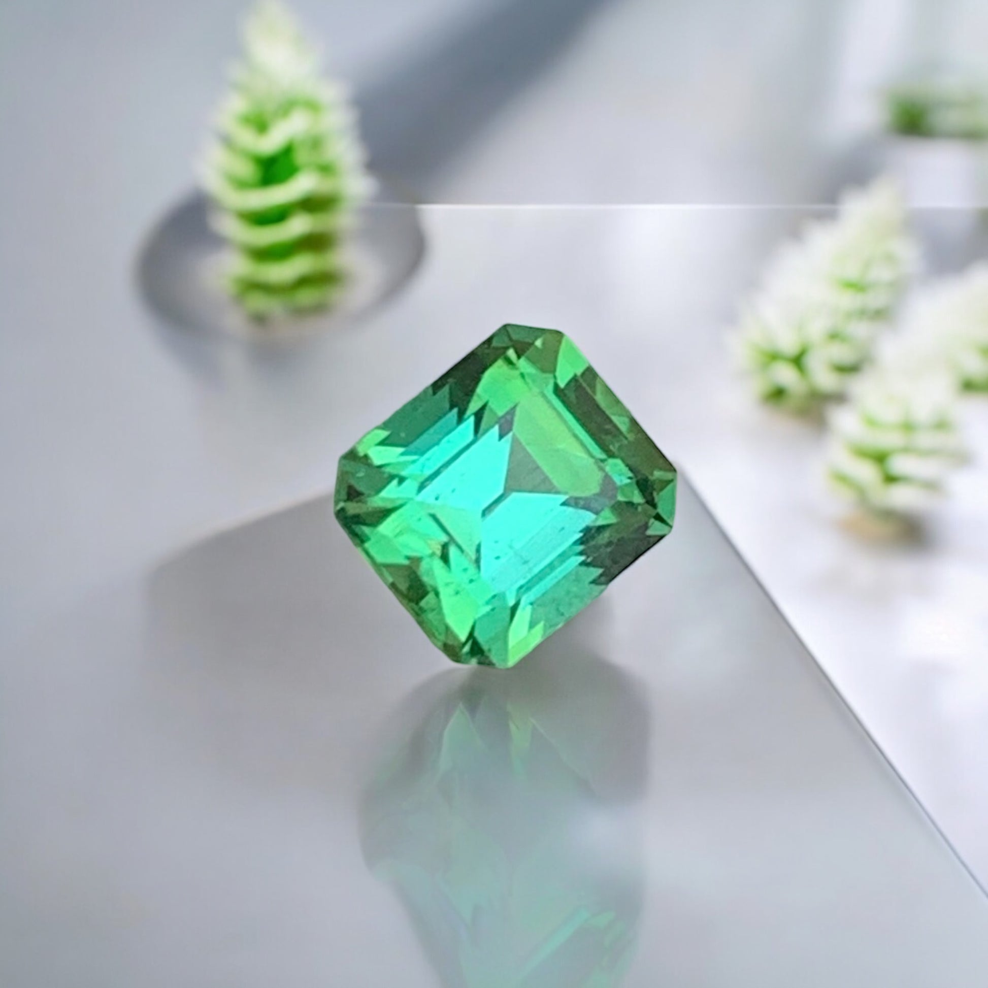 Green Tourmaline
Close-up of 0.90 carat natural Asscher cut bluish green tourmaline
