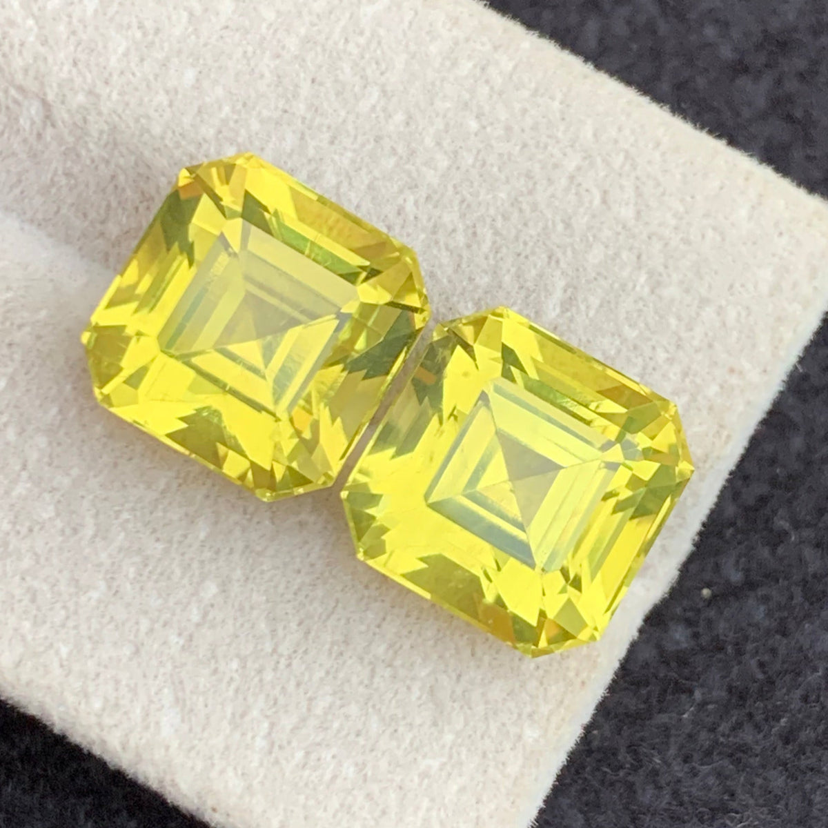 Yellow quartz pair on white background showing symmetry
Cushion cut dimensions comparison