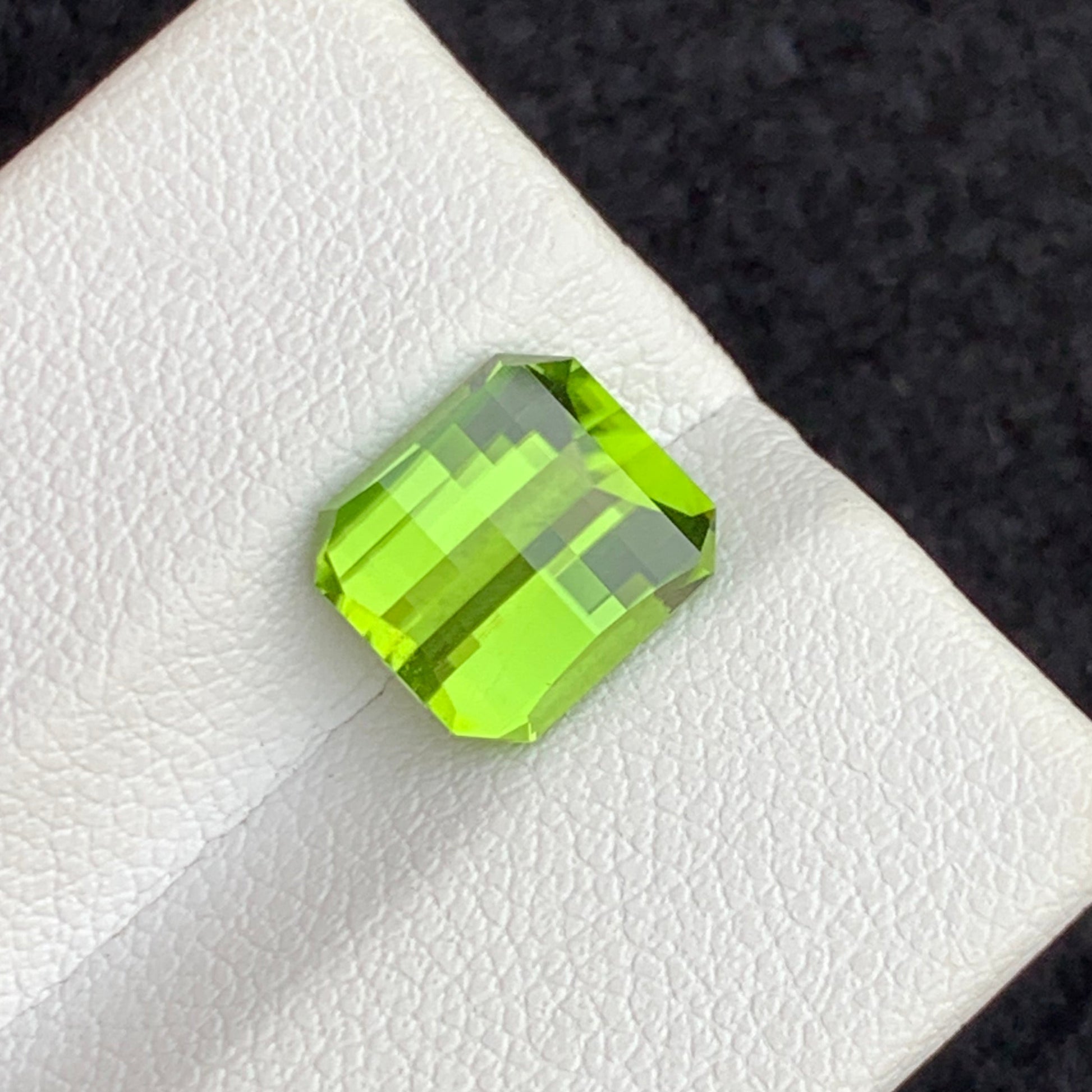 Pixel cut green gemstone
Loose olive peridot