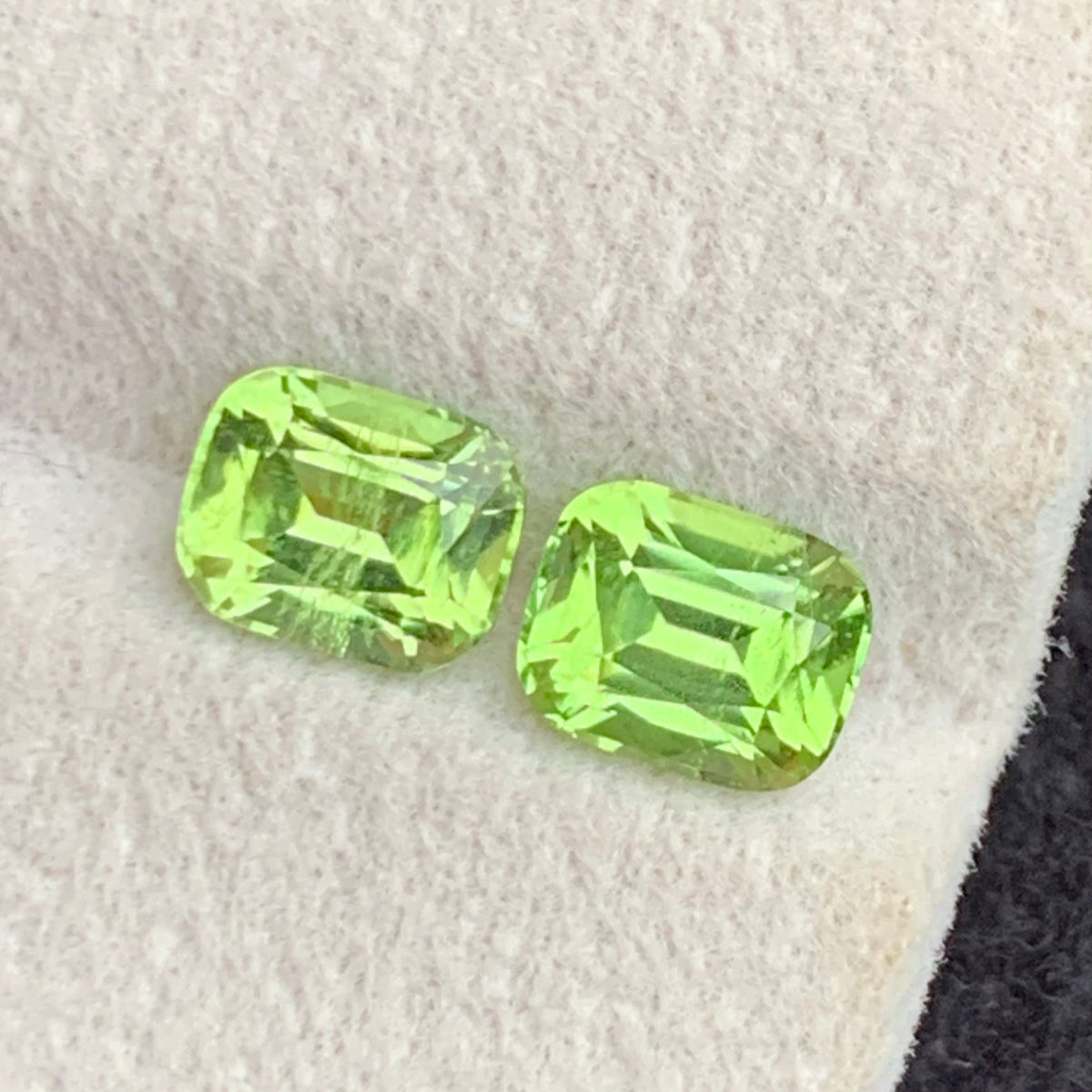  Greenish Yellow Peridot Pair
 Greenish Yellow Peridot gemstone
Cushion cut peridot pair side profile
Greenish yellow peridot pair slightly included clarity close-up