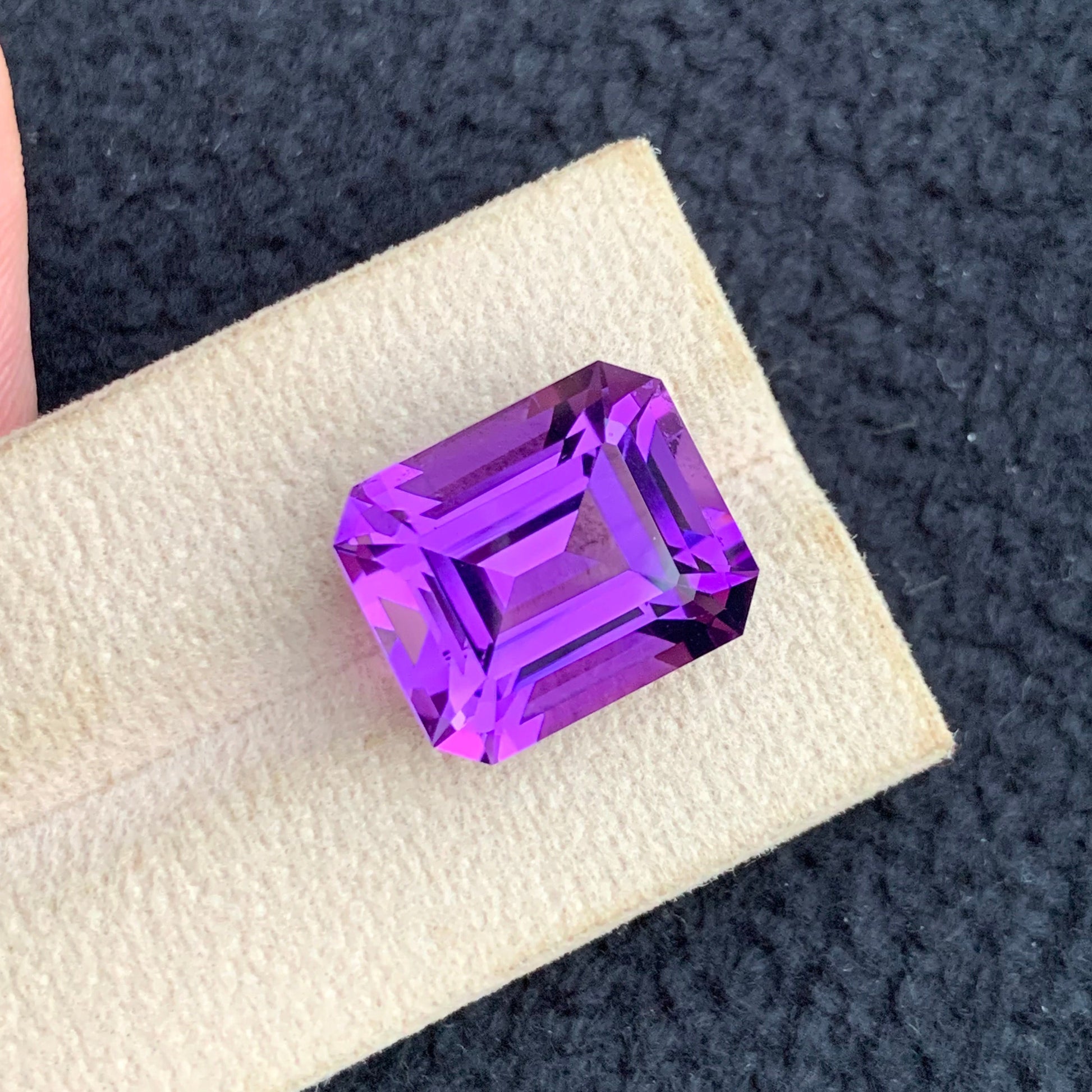 Pink Purple Amethyst ring
Pink Purple Amethyst pendant
Large emerald cut amethyst gemstone from Brazil
Premium faceted pink purple amethyst loose stone
Certified natural amethyst gemstone close-up view