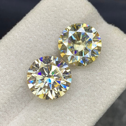 Light Gold moissanite gemstone
Light Gold moissanite ring
Light golden moissanite pair 9.25 carat round cut gemstones
Lab grown moissanite matched pair