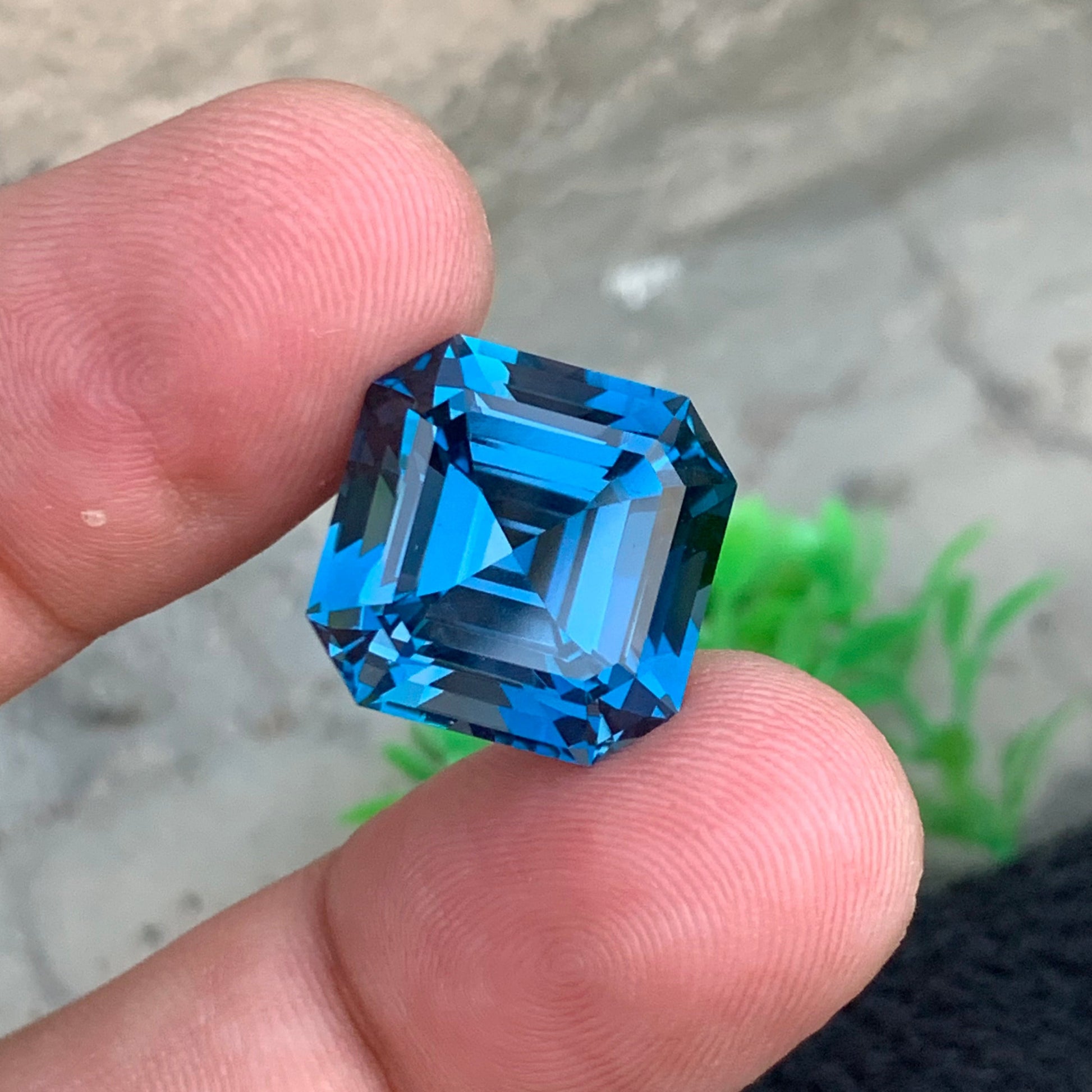 London Blue Topaz 
London Blue Topaz jewelry
London blue topaz 23.80 carat Asscher cut gemstone
large blue topaz gemstone Africa loupe clean stone