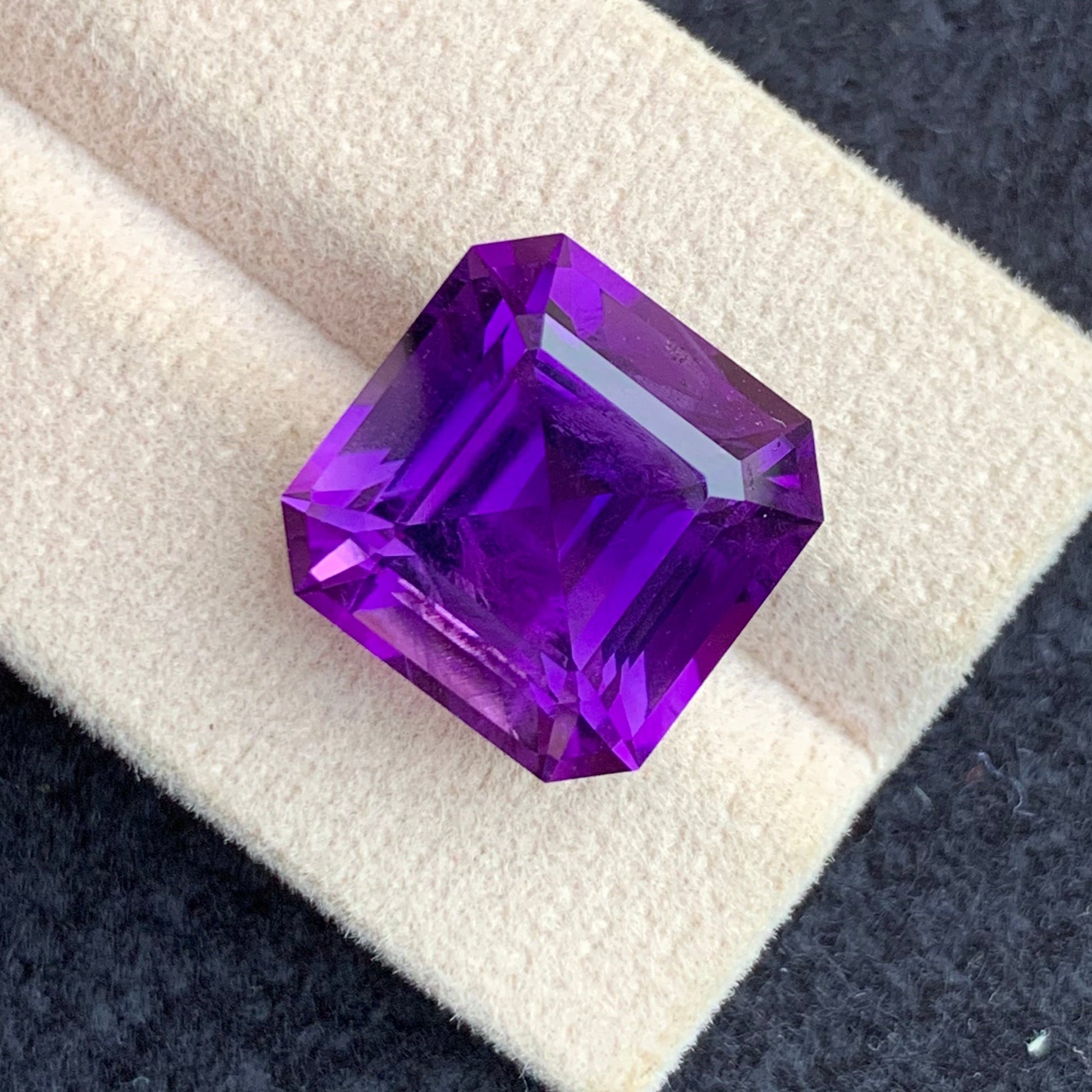 Geometric Asscher cut purple gemstone