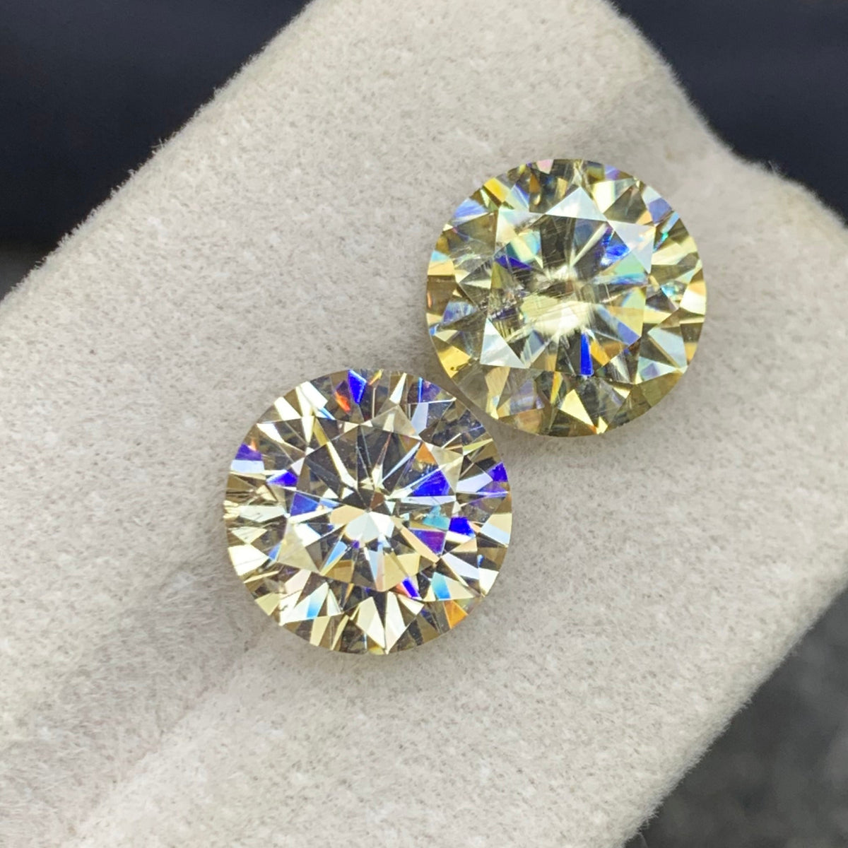 Moissanite pair held for scale
Moissanite pair reflecting light showing diamond-like fire