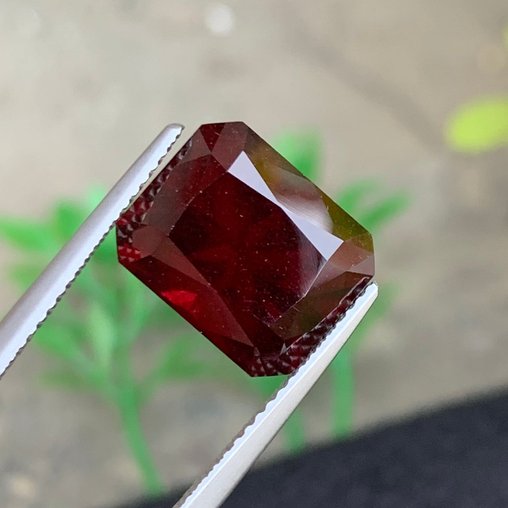 Dark red rhodolite gemstone
Large cushion cut garnet