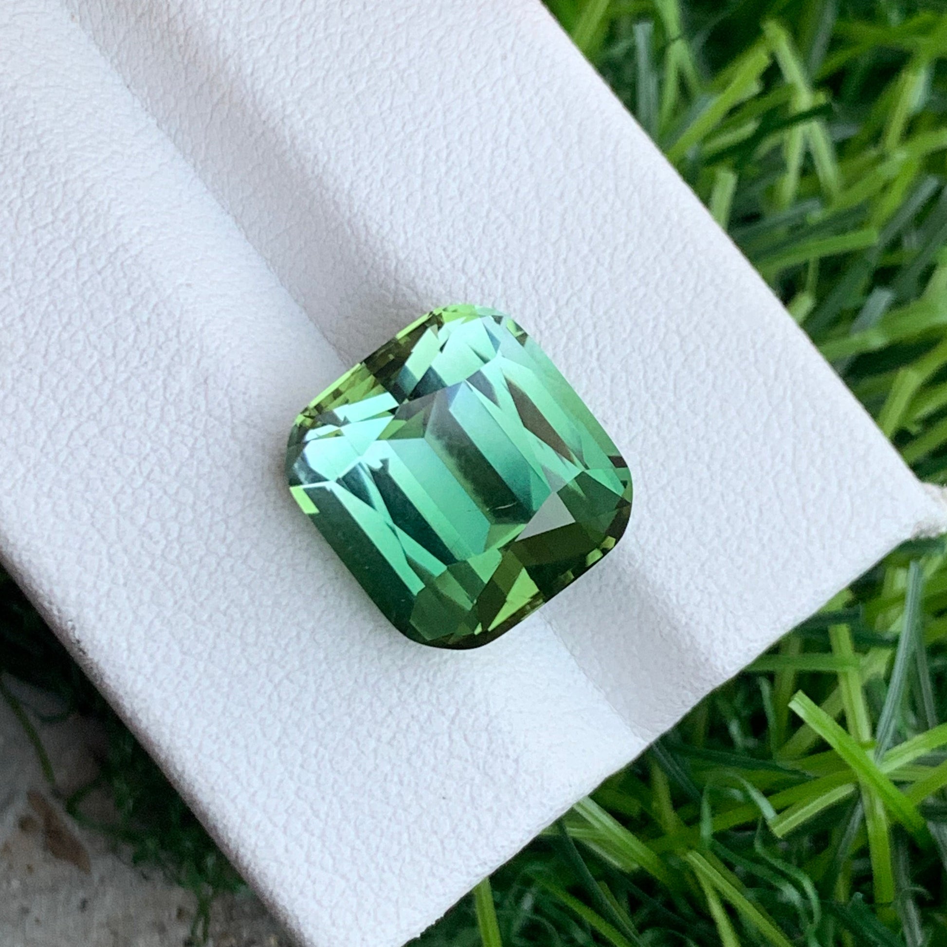 Rare Afghan 10 carat bicolor tourmaline clean clarity
Green bicolor tourmaline gemstone close-up cushion shape
