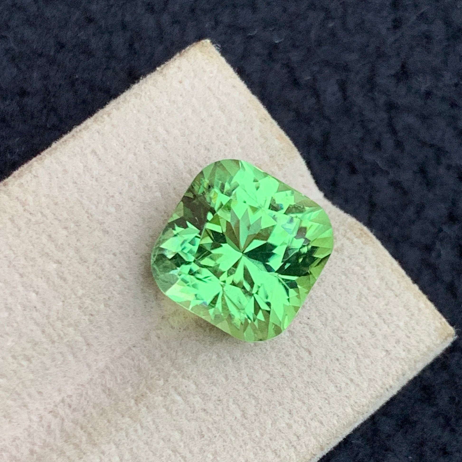 OneStep Gems premium apple green peridot collection
cushion cut peridot gemstone sparkling close-up