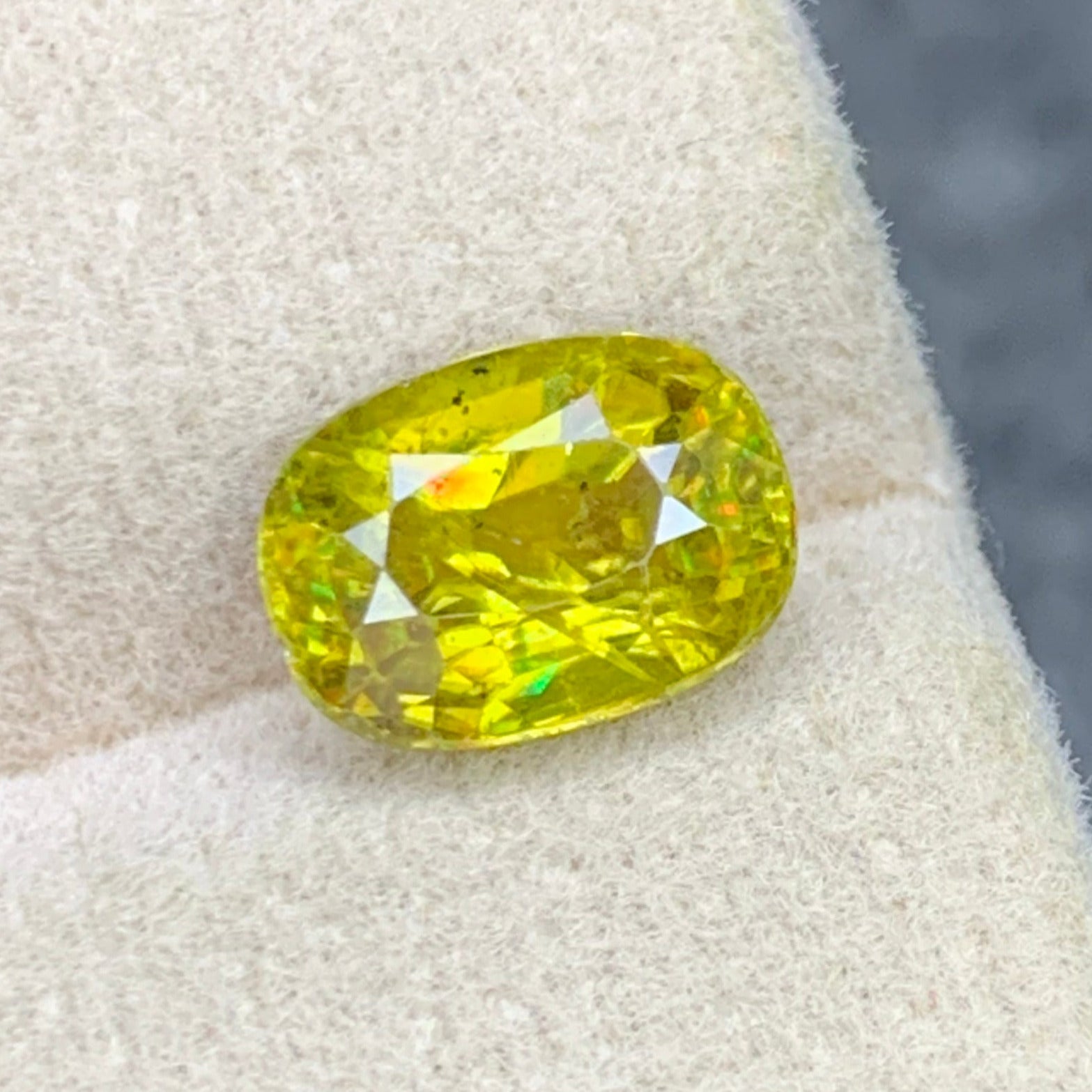 Oval cut Sphene gemstone with exceptional dispersion