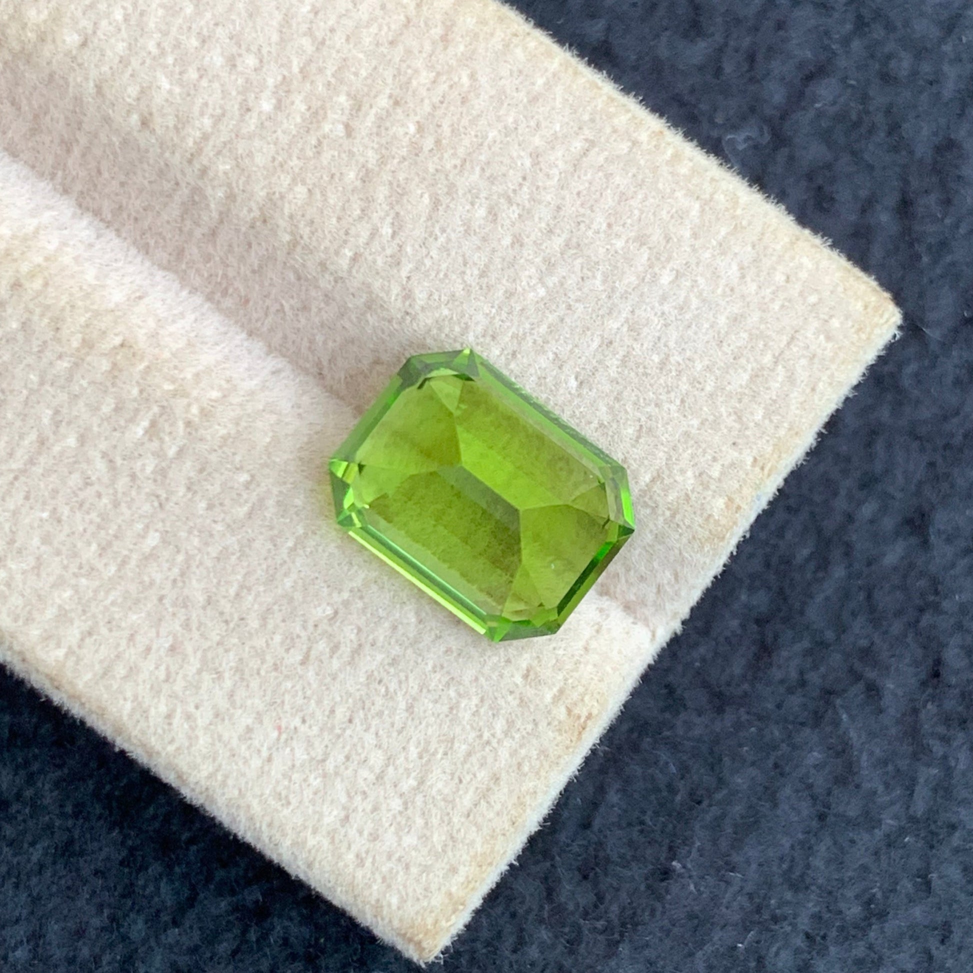 Pakistan origin peridot gemstone emerald cut close up
luxury peridot gemstone pea green loose stone
