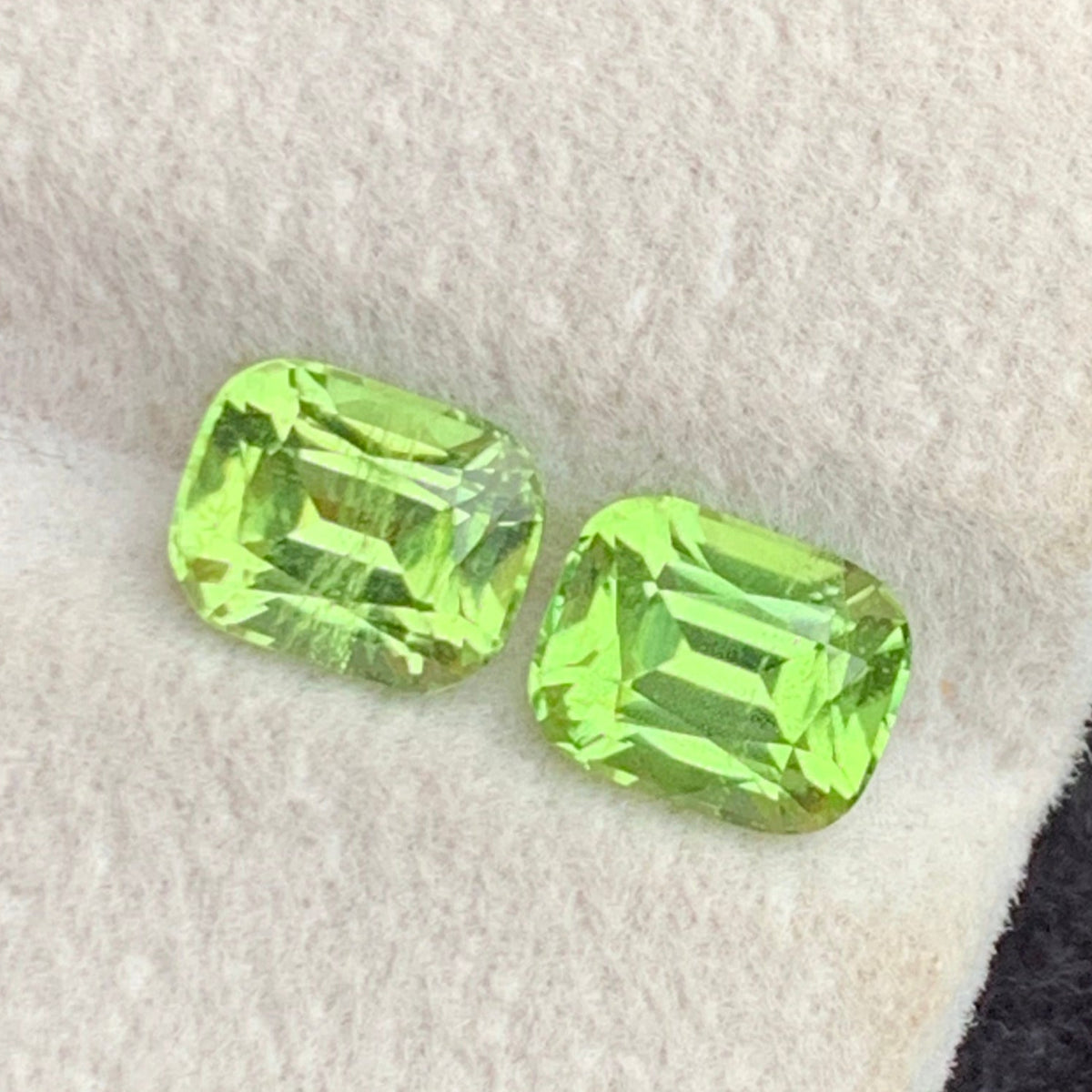 Natural greenish yellow peridot pair 2.55 carat cushion cut gemstones
Peridot matched pair from Pakistan, top view