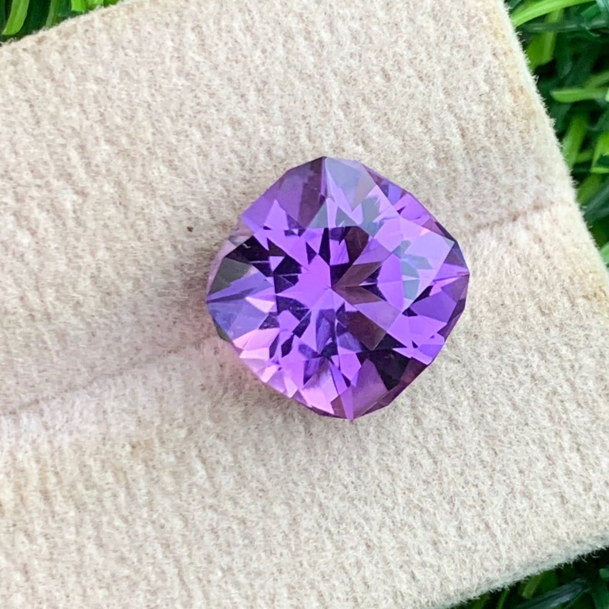 Pink purple amethyst held for scale
Amethyst reflecting light showing color depth