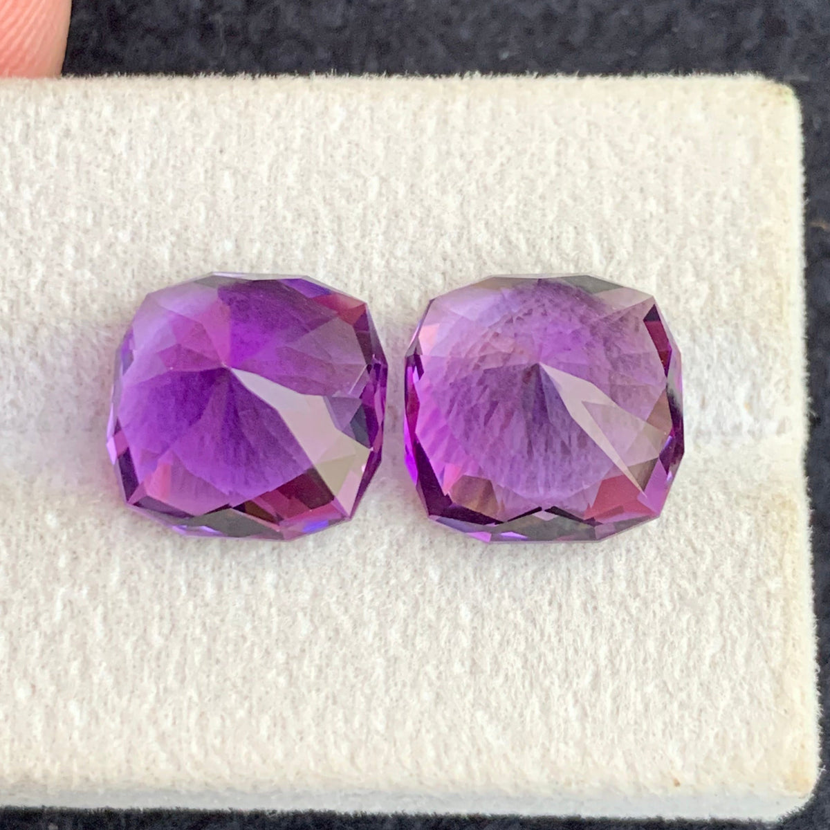 Fancy cut amethyst side profile showing brilliance
Pink purple amethyst loupe clean clarity close-up