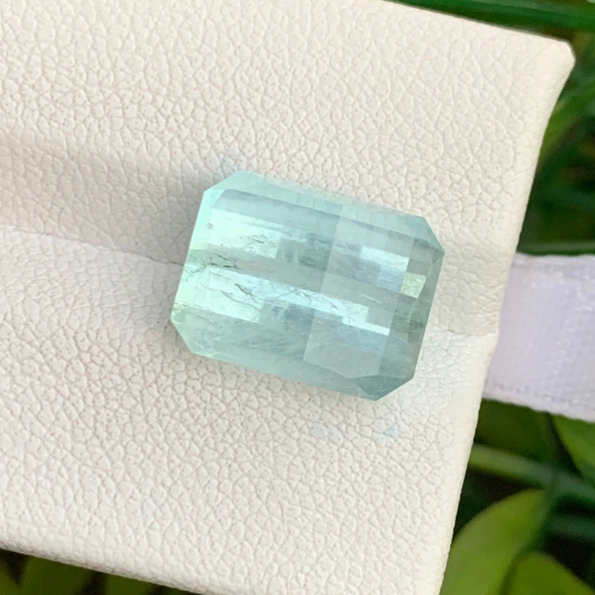 Pixel cut aquamarine side profile showing brilliance
Icy blue aquamarine slightly included clarity close-up