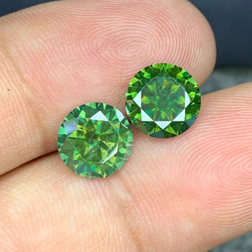  Green Moissanite earrings
 Green Moissanite gift
Round cut green moissanite pair side profile
Green moissanite pair eye clean clarity close-up