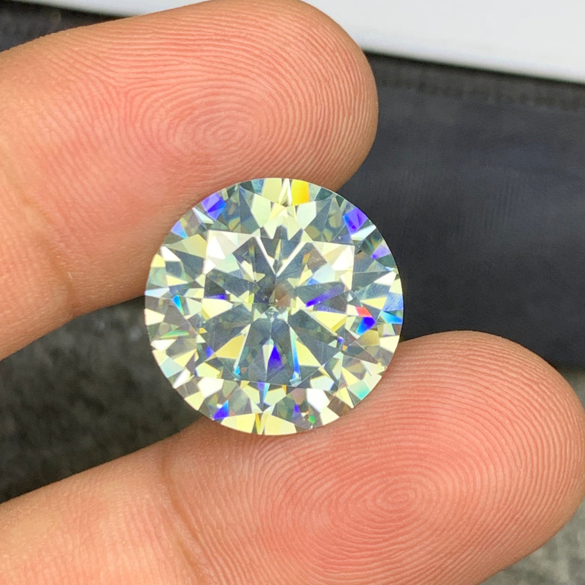 Moissanite ring
Moissanite necklace
Round cut moissanite side profile showing brilliance
White moissanite SI clarity close-up