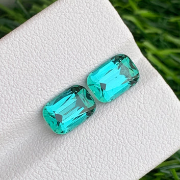 blue green tourmaline pair long cushion cut loose gemstones
lagoon tourmaline earrings pair jewelry stones close view