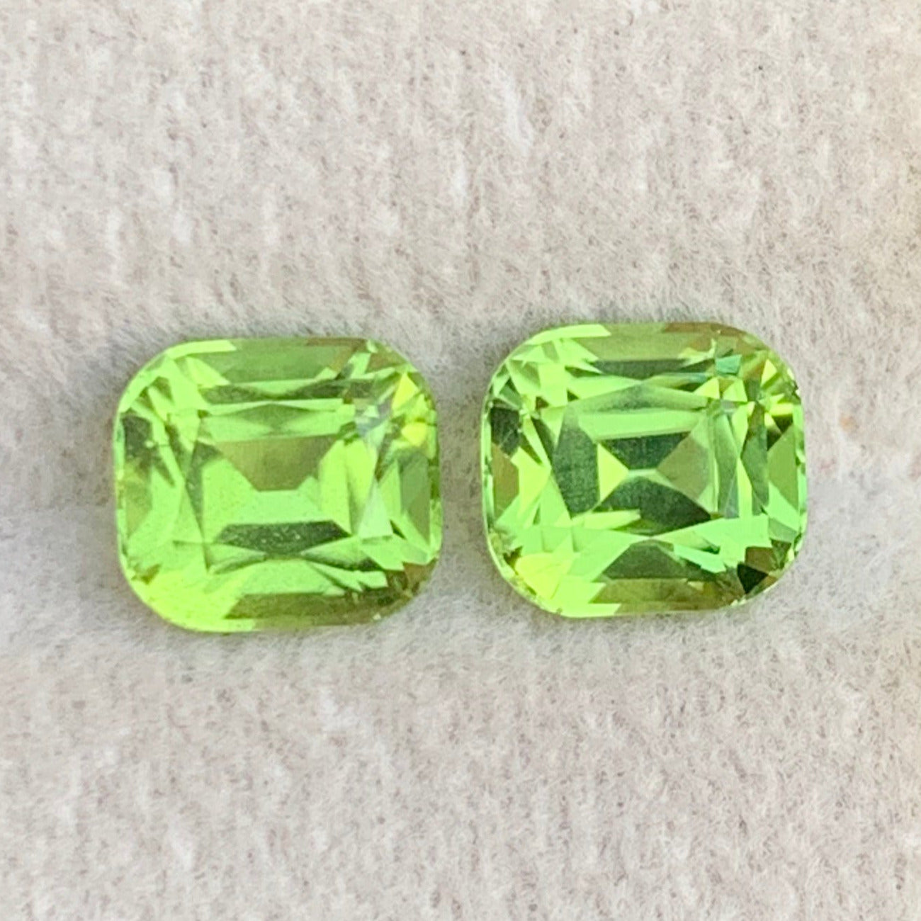 cushion cut green peridot gemstones
green peridot gemstone pair by Onestep Gems