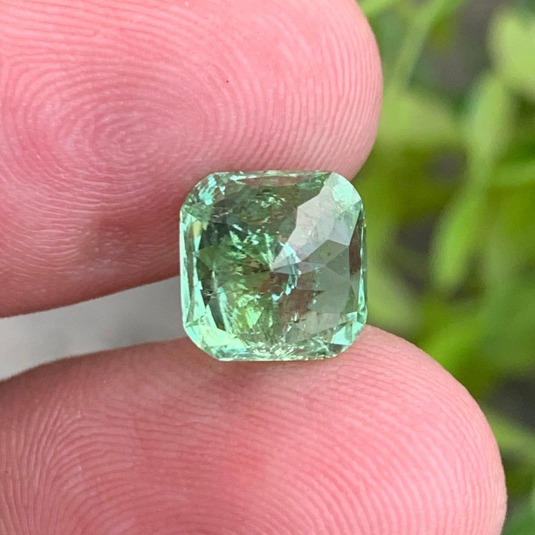 cushion cut green tourmaline 4.35 carats
natural green tourmaline slightly included
afghan tourmaline gemstone mint color