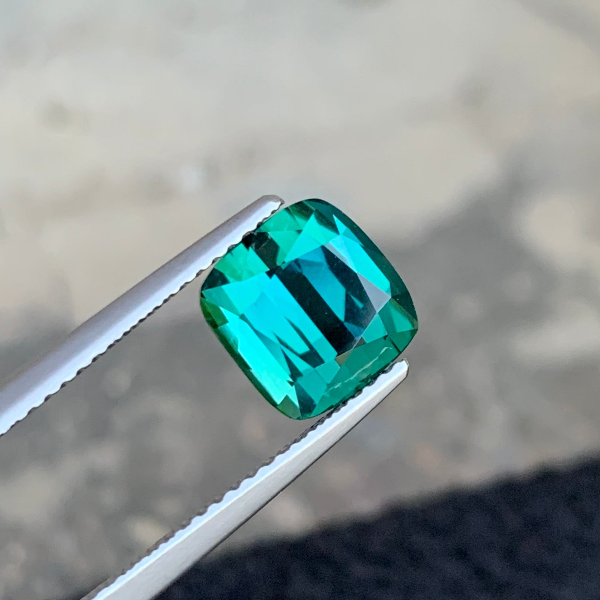 cushion cut mint green tourmaline loose gemstone
loupe clean bluish green tourmaline close up