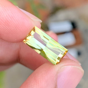 Greenish Yellow Tourmaline ring
fancy baguette cut tourmaline loose stone
greenish yellow tourmaline close view
