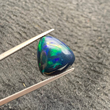 greenish blue Ethiopian opal gemstone triangular cut