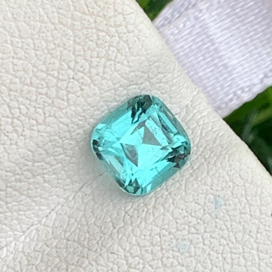 bluish green tourmaline gemstone close up
cushion cut lagoon tourmaline stone