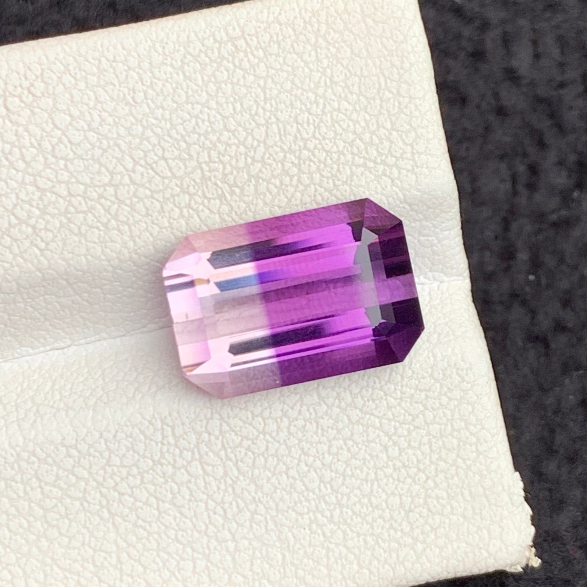 Loose Bicolor Amethyst 
untreated bicolor amethyst gemstone

emerald cut amethyst loupe clean

faceted bicolor amethyst quartz