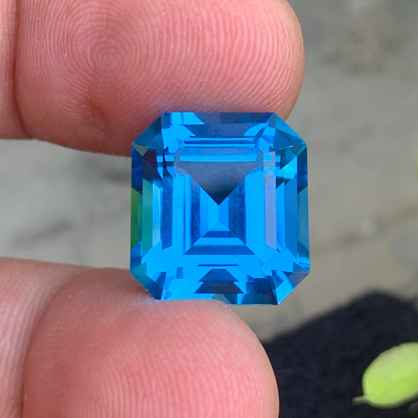loupe clean blue topaz gemstone
emerald cut topaz gemstone
onestep gems swiss blue topaz