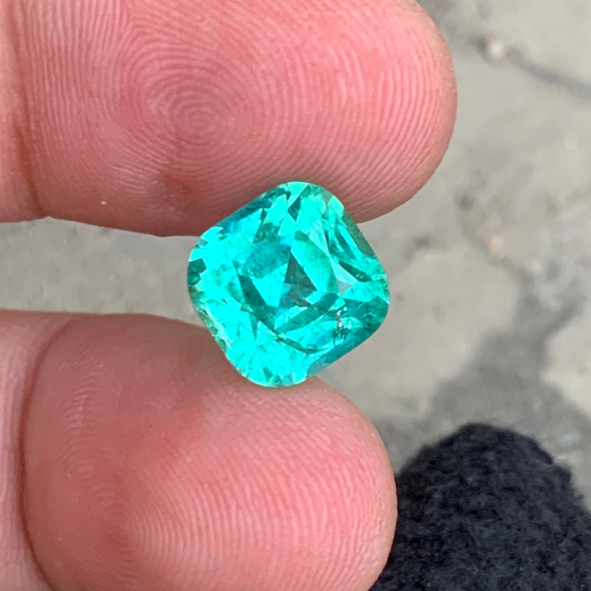 luxury green blue gemstone
tourmaline cushion cut close up