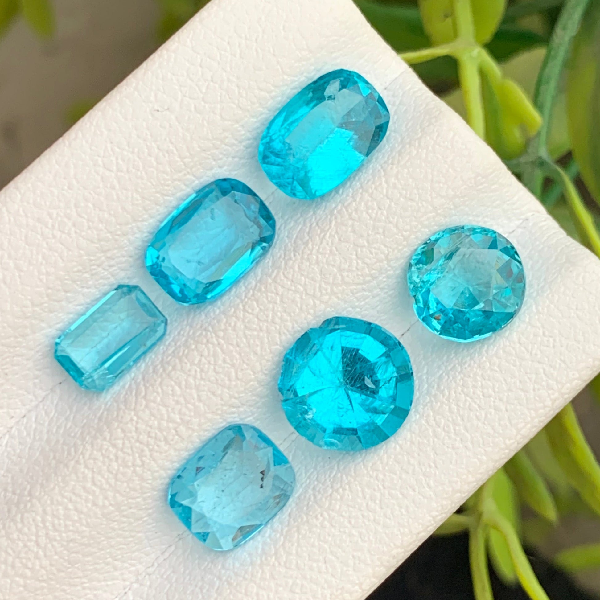 natural blue apatite lot 8.85 carats
mixed shape apatite gemstones close up
neon blue apatite loose gemstones

