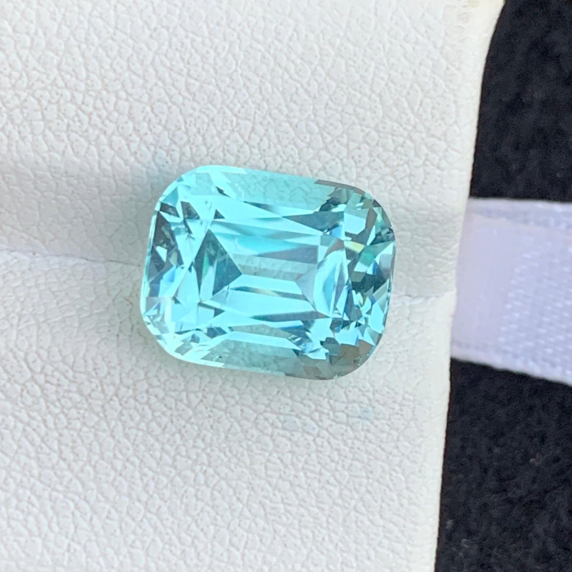 premium aquamarine gemstone macro detail high clarity
African aquamarine gemstone cushion cut close up