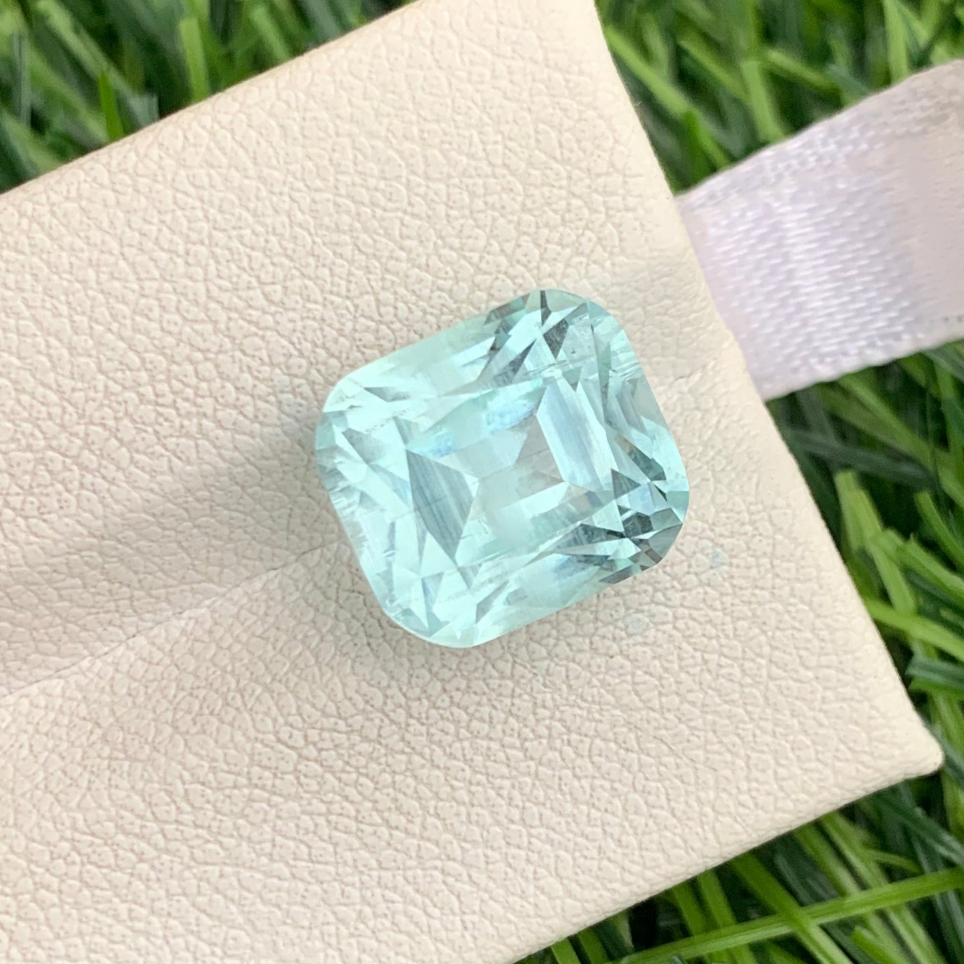 premium natural aquamarine stone sky blue color VVS clarity
large aquamarine gemstone 8.60 carat facet reflection close detail
Pakistan origin aquamarine gemstone cushion cut loose stone