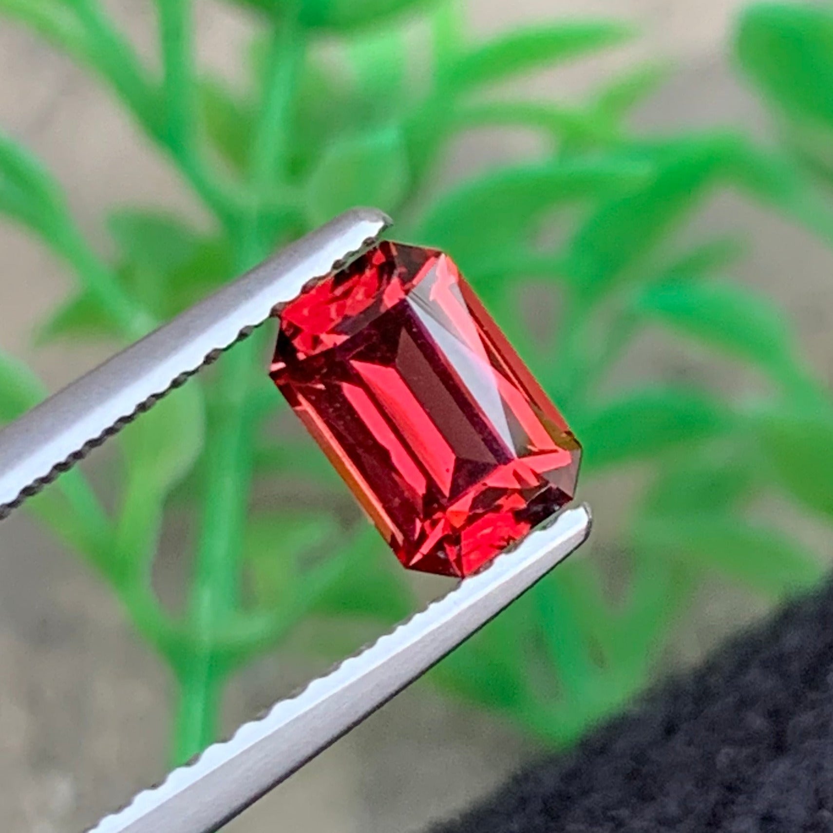 premium rhodolite garnet gemstone purplish red tone close up
scissor cut garnet gemstone high clarity Madagascar origin