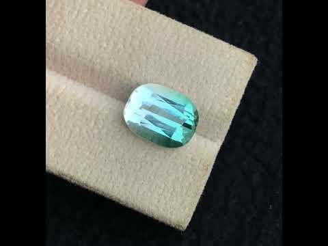 premium cushion cut tourmaline gem
one step gems bicolor tourmaline