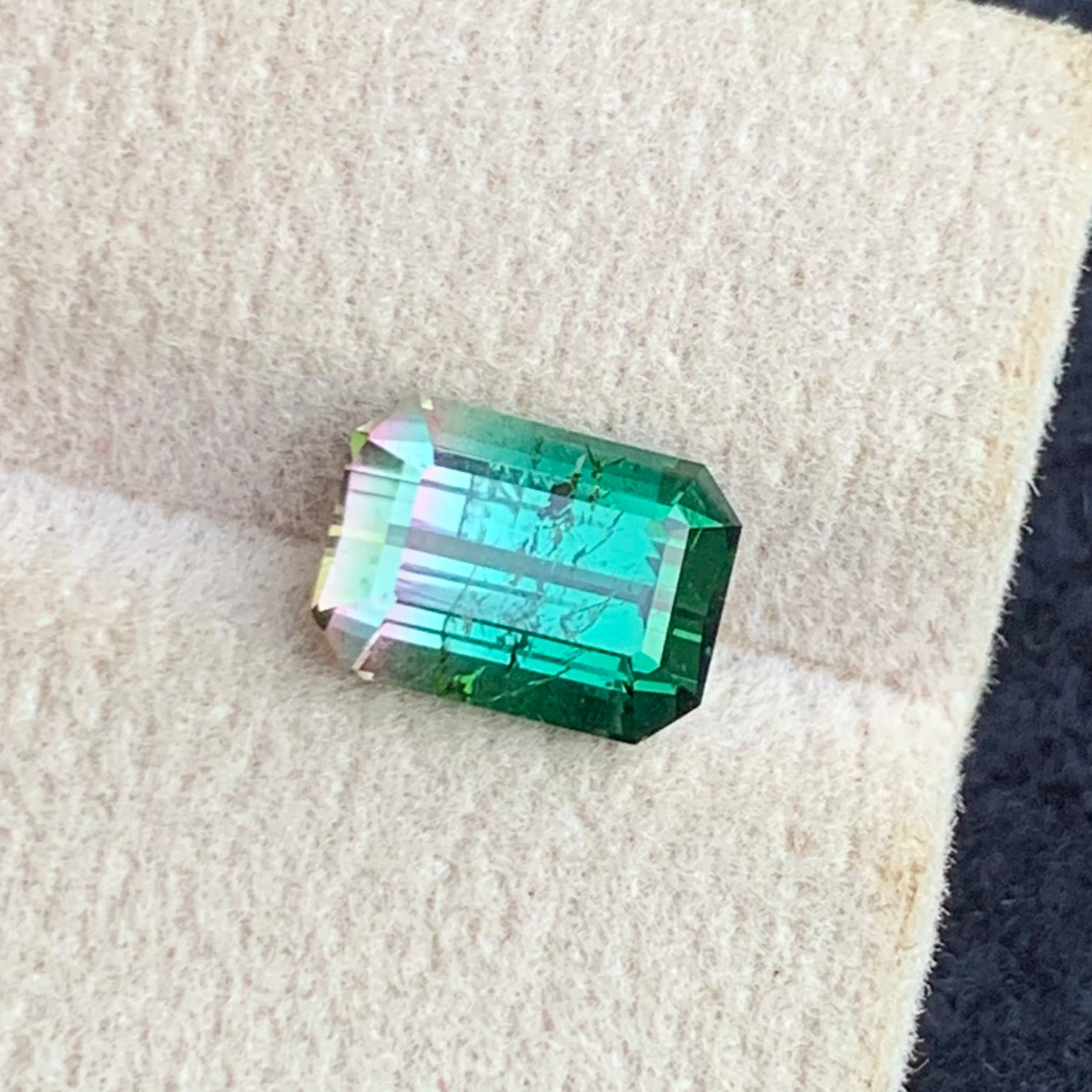 rare bicolor tourmaline gemstone color zoning macro view
luxury watermelon tourmaline loose gemstone for jewelry design
natural dual color tourmaline emerald cut gemstone close up