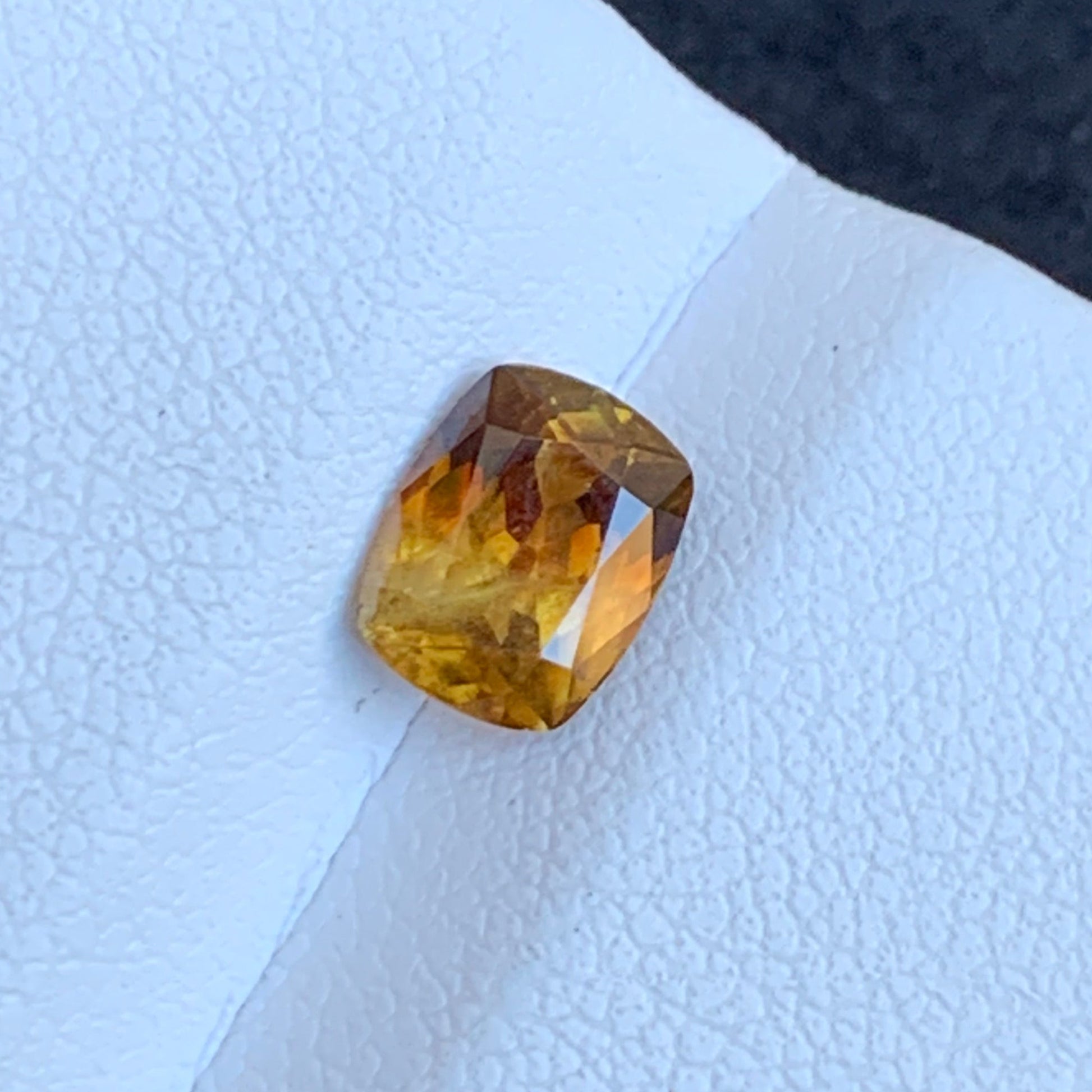 gold and yellow gemstone